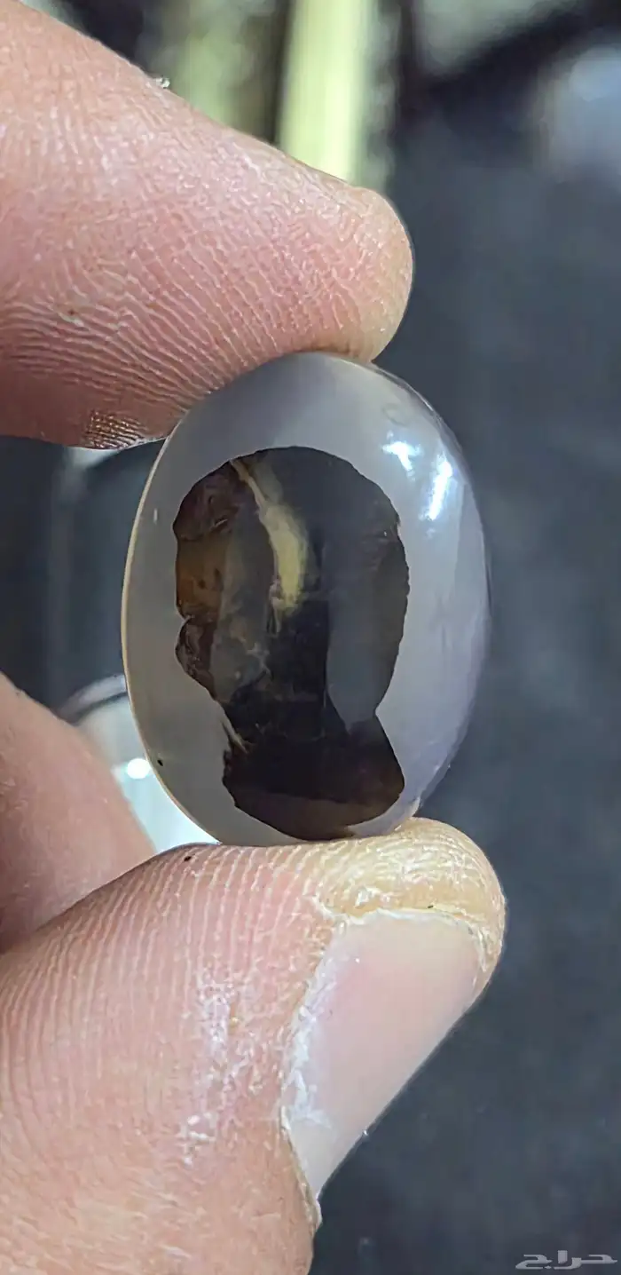 حجر عقيق مصور - وجه طفل و وجه رجل 0