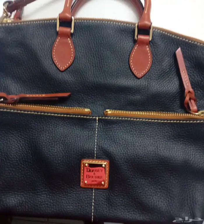 شنطة Dooney   Bourke اصلية ما فيها ولا قطعة جديدة السعر 700 0