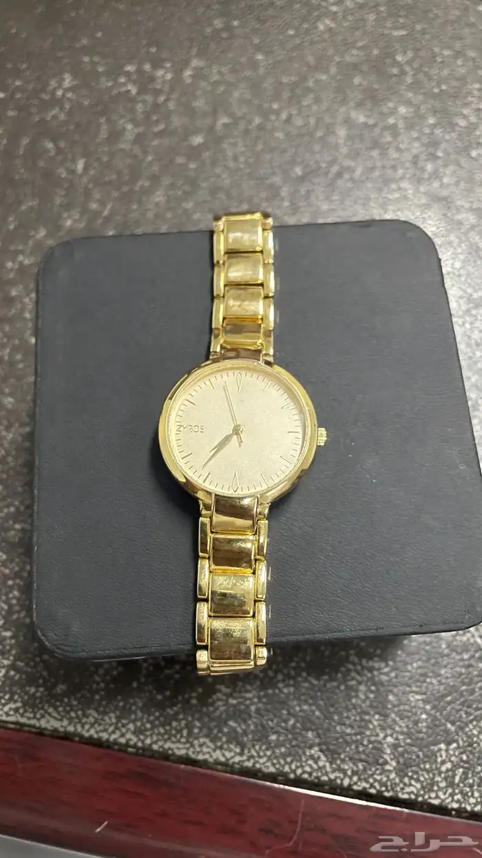 ساعة دكني ذهبي نسائيه 0