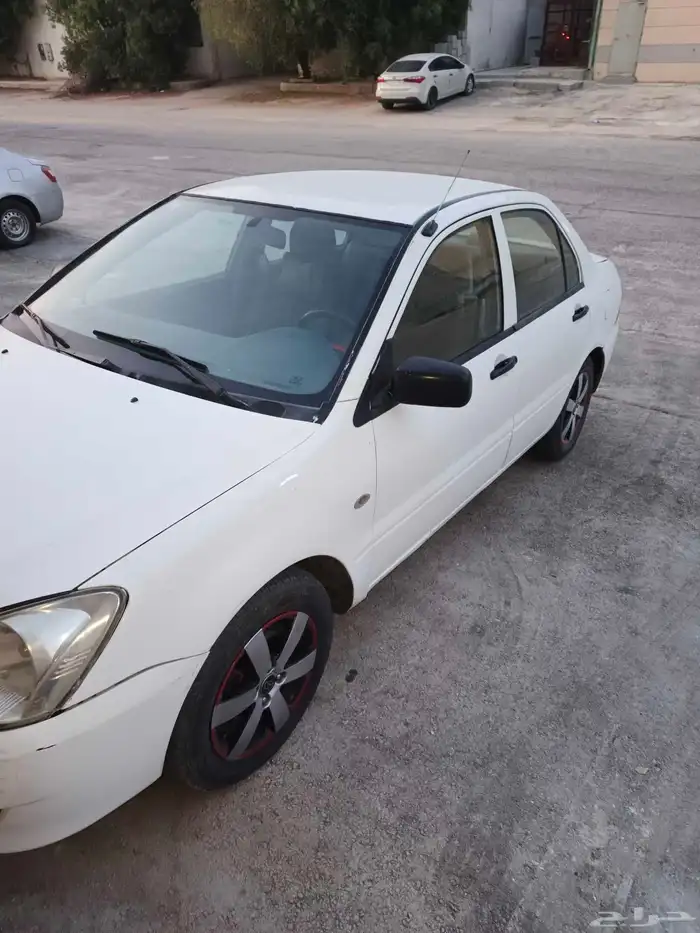 متسوبيسي لانسر بومة 2004 8