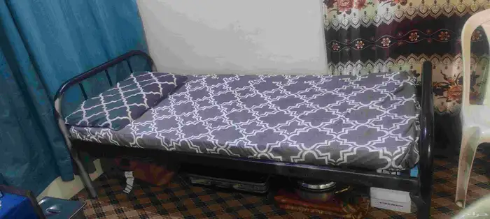 single metal bed with metres and pillow 1
