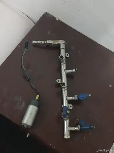 شمعة لومينا يمين وطرمبة بنزين ومسطرة بخاخات لومينا 2005 index