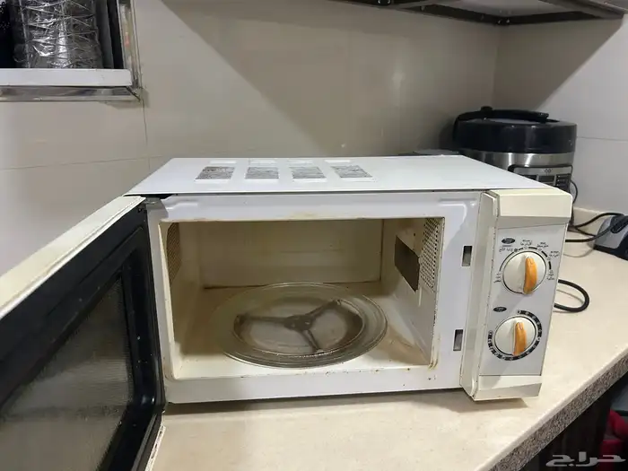 غسالة تعبئة علوية بحالة جيدة مع ميكرويف يلزمه اصلاح 5