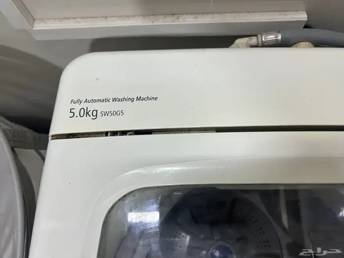 غسالة تعبئة علوية بحالة جيدة مع ميكرويف يلزمه اصلاح 2