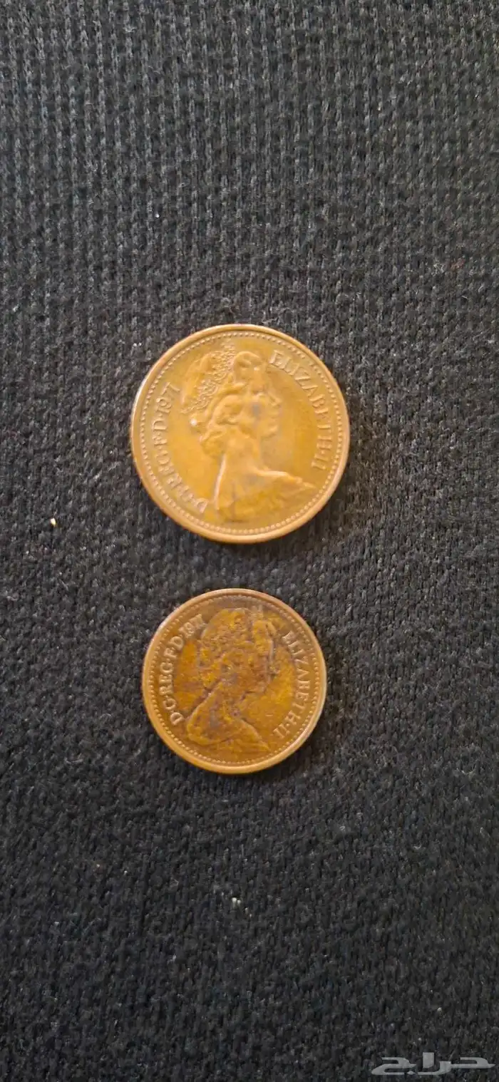 عملة بريطانية من 1971 الملكة اليزابيث 2 و عملة امريكية 1961 0