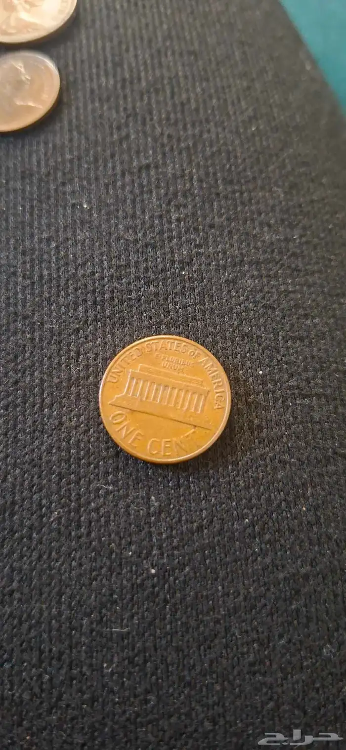 عملة بريطانية من 1971 الملكة اليزابيث 2 و عملة امريكية 1961 2