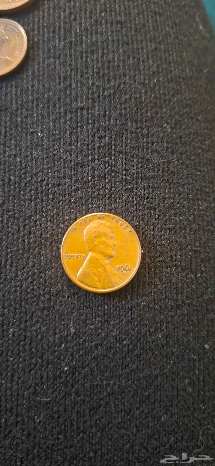 عملة بريطانية من 1971 الملكة اليزابيث 2 و عملة امريكية 1961 1