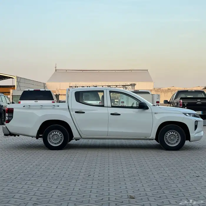 ميتسوبيشي 2023 L200 ديزل غمارتين بدي وكاله ممشى 98 الف 7