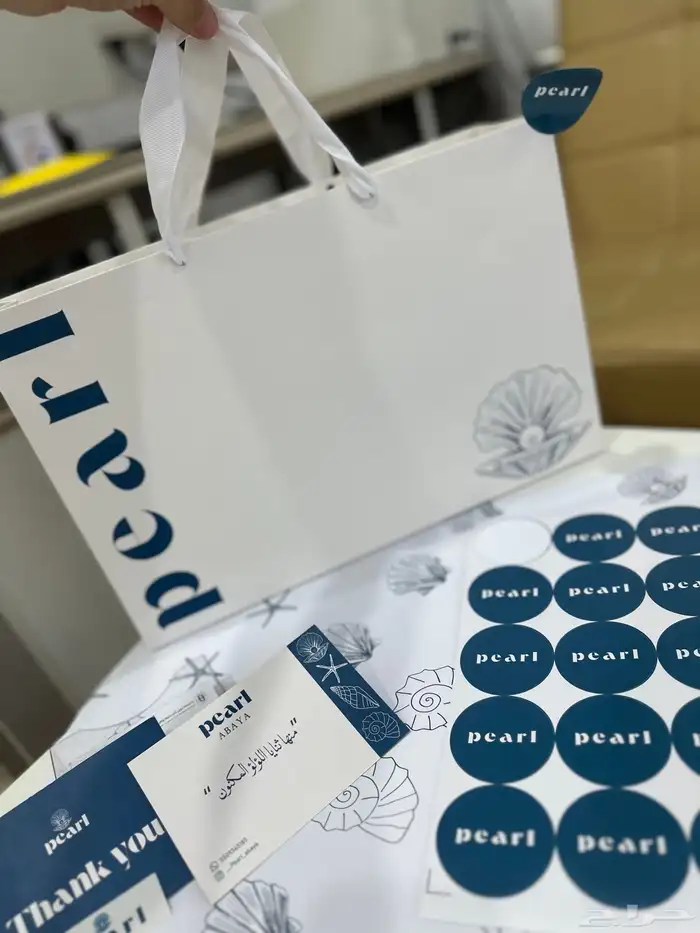 طباعة بكج تغليف عبايات اكياس ليبل قماش تاقات ورق تغليف 10