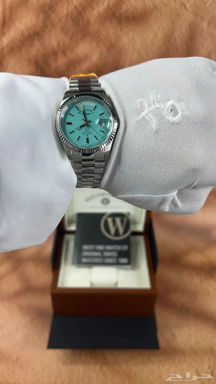 ساعة وست اند(ام صليب) باللون التيفاني 1