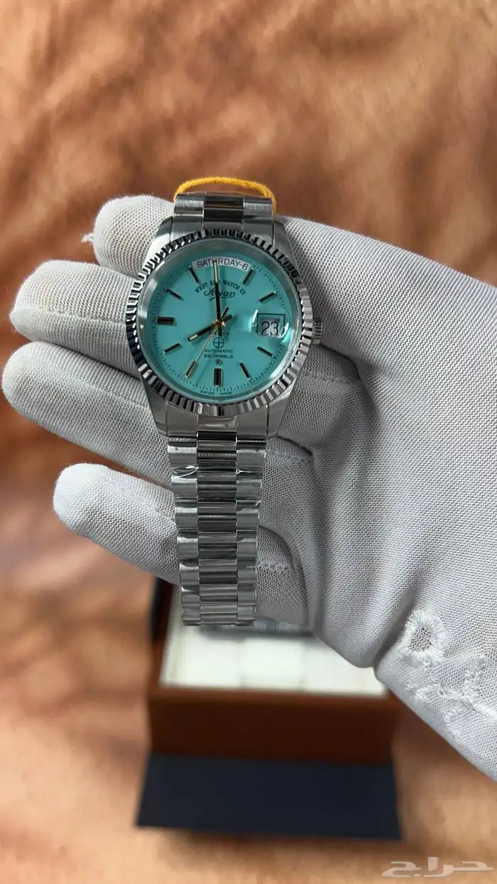 ساعة وست اند(ام صليب) باللون التيفاني 0