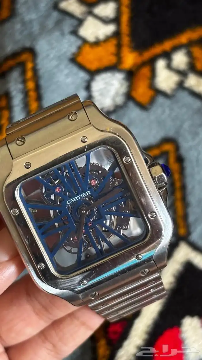 ساعه كارتييه سانتوس سكيليتون مينا ازرق إطار مكشوف نيكل درجه 1