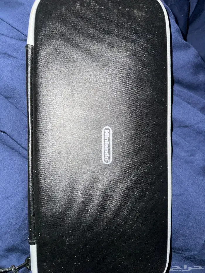 نيتندو سويتش مع اغراضه كامل وعليها حمايه بالكامل ومعه حقيبه 0