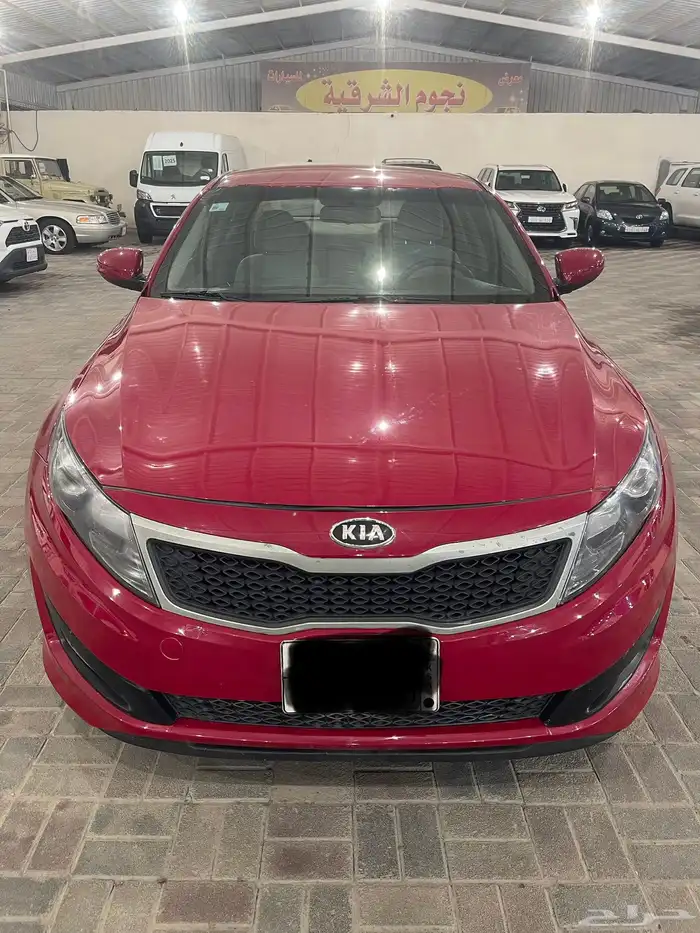كيا أوبتيما موديل 2013 نص فل احمر دم غزال 0