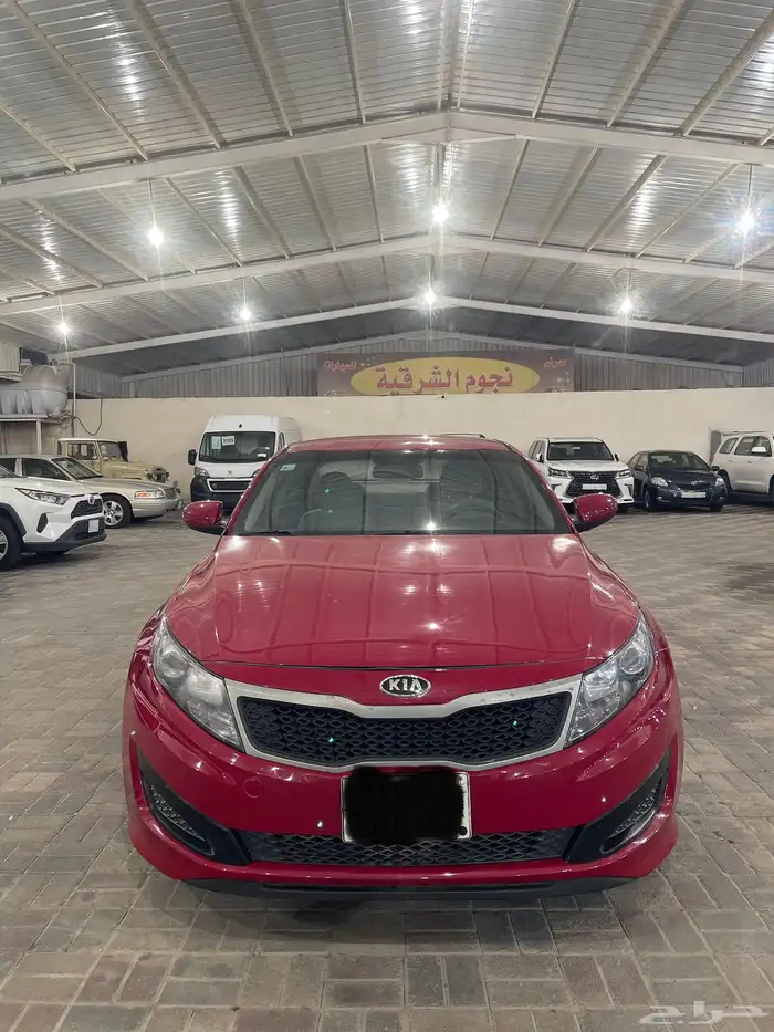 كيا أوبتيما موديل 2013 نص فل احمر دم غزال 13