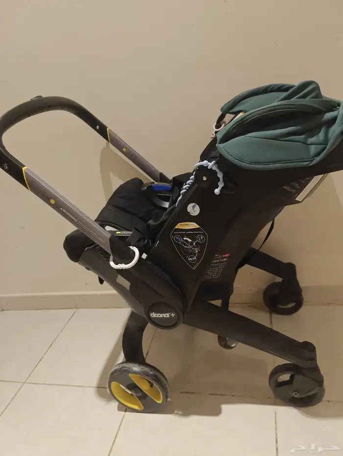 عربة أطفال و كرسي سيارة 2 في 1 doona أصلية من mumzworld 1