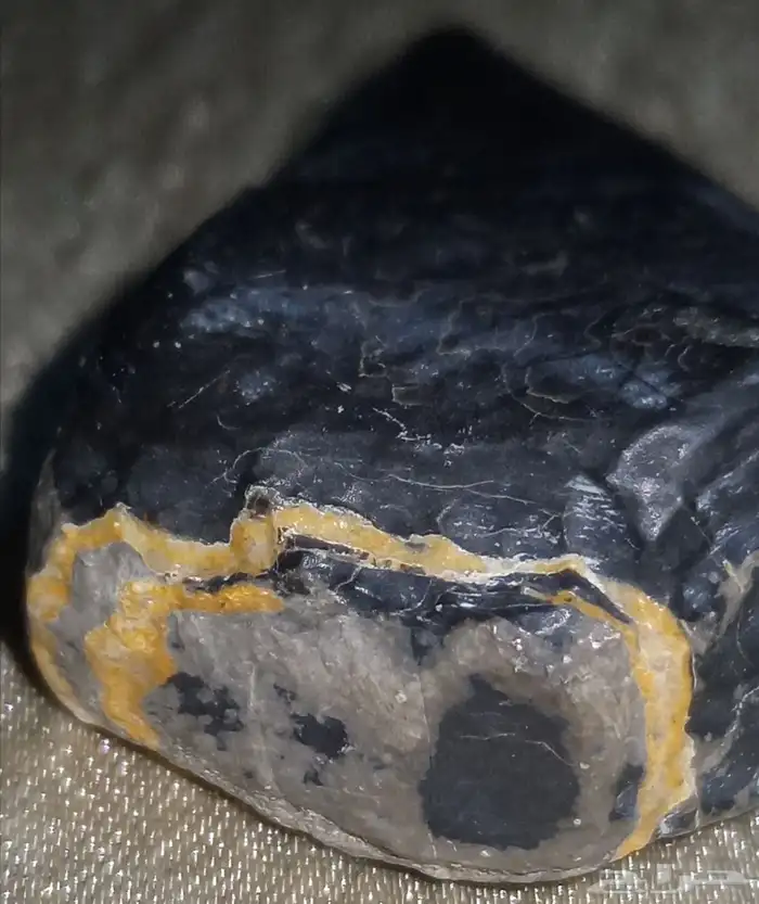 black stone in the shape of a spearhead..شكل رأس رمح 5