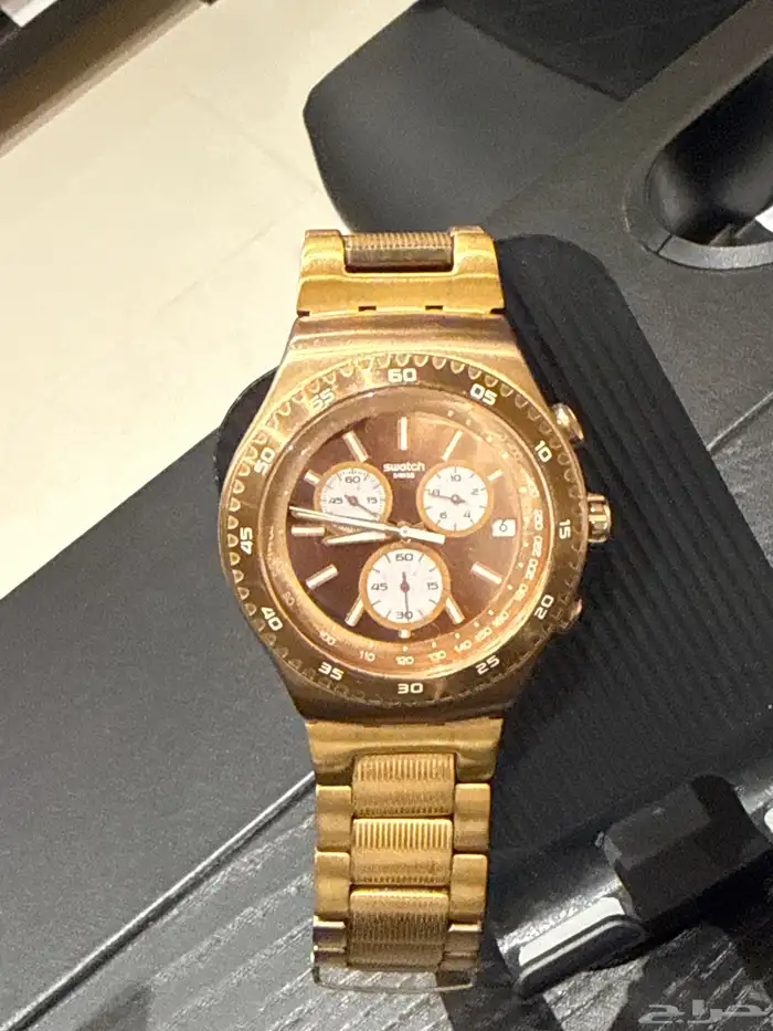 ساعه نحاسيه برونزيه ماركة swatch الأصليه 0
