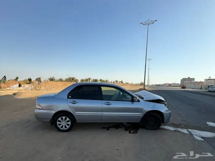 للبيع لانسر ميتسوبيشي مصدومه 0