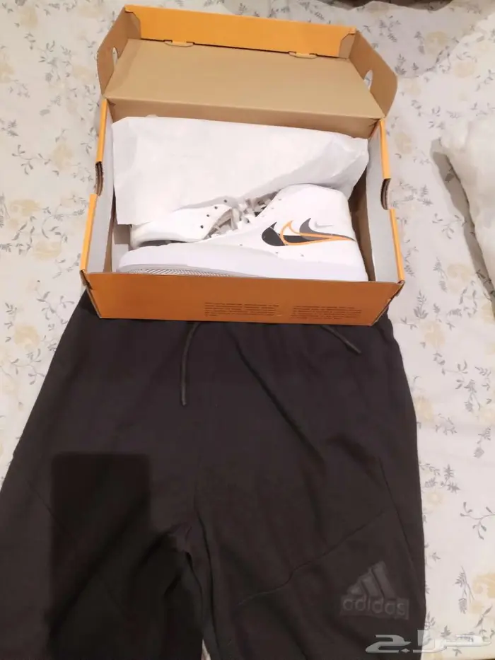 Nike shoes and addidas short 0