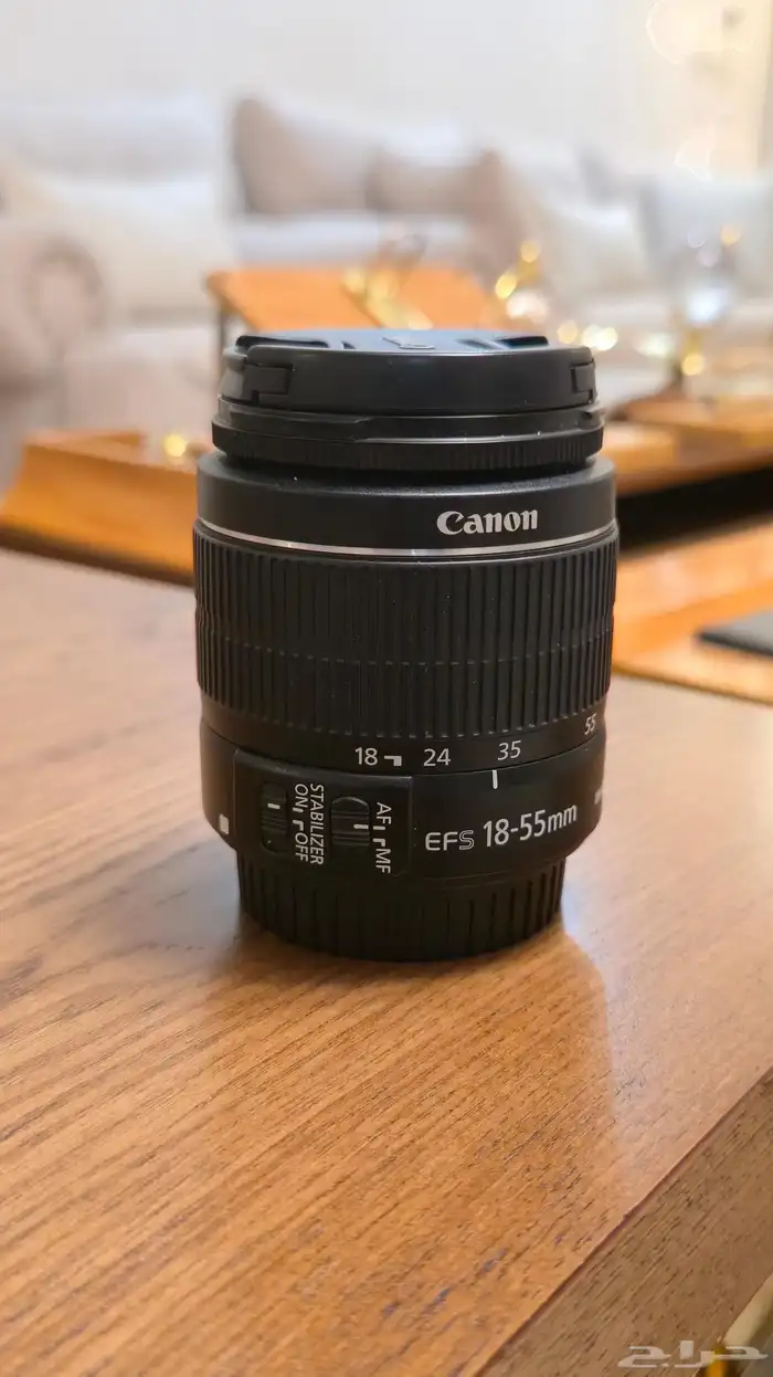 Canon EOS Rebel SL1 مع عدستها 7