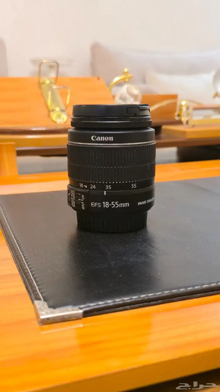 Canon EOS Rebel SL1 مع عدستها 9