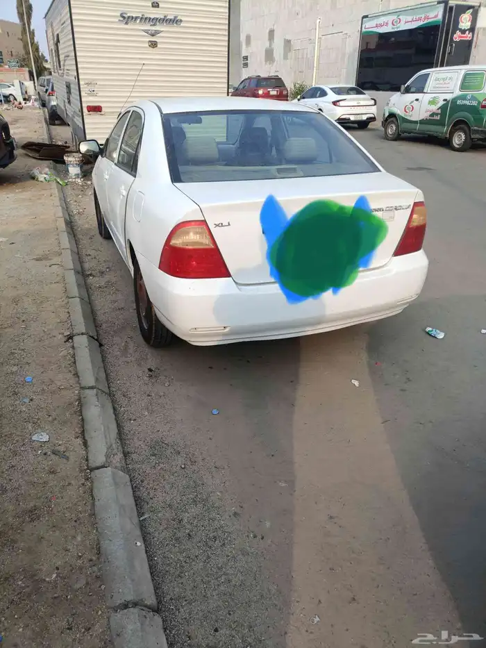 تويوتا كورلا موديل 2004.اللون ابيض ماكينه وجير علي الشرط. 1