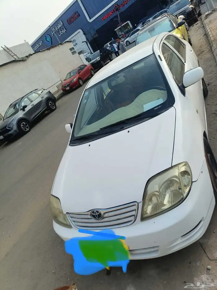 تويوتا كورلا موديل 2004.اللون ابيض ماكينه وجير علي الشرط. 0