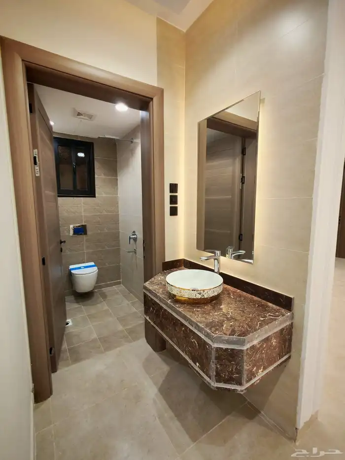 للبيع بحي الاسكان شقق تمليك علوي ب550 الف سطح خاص مصعد شغال 13