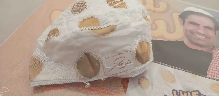 طاقية عامر بوستر توقيع عامر 1