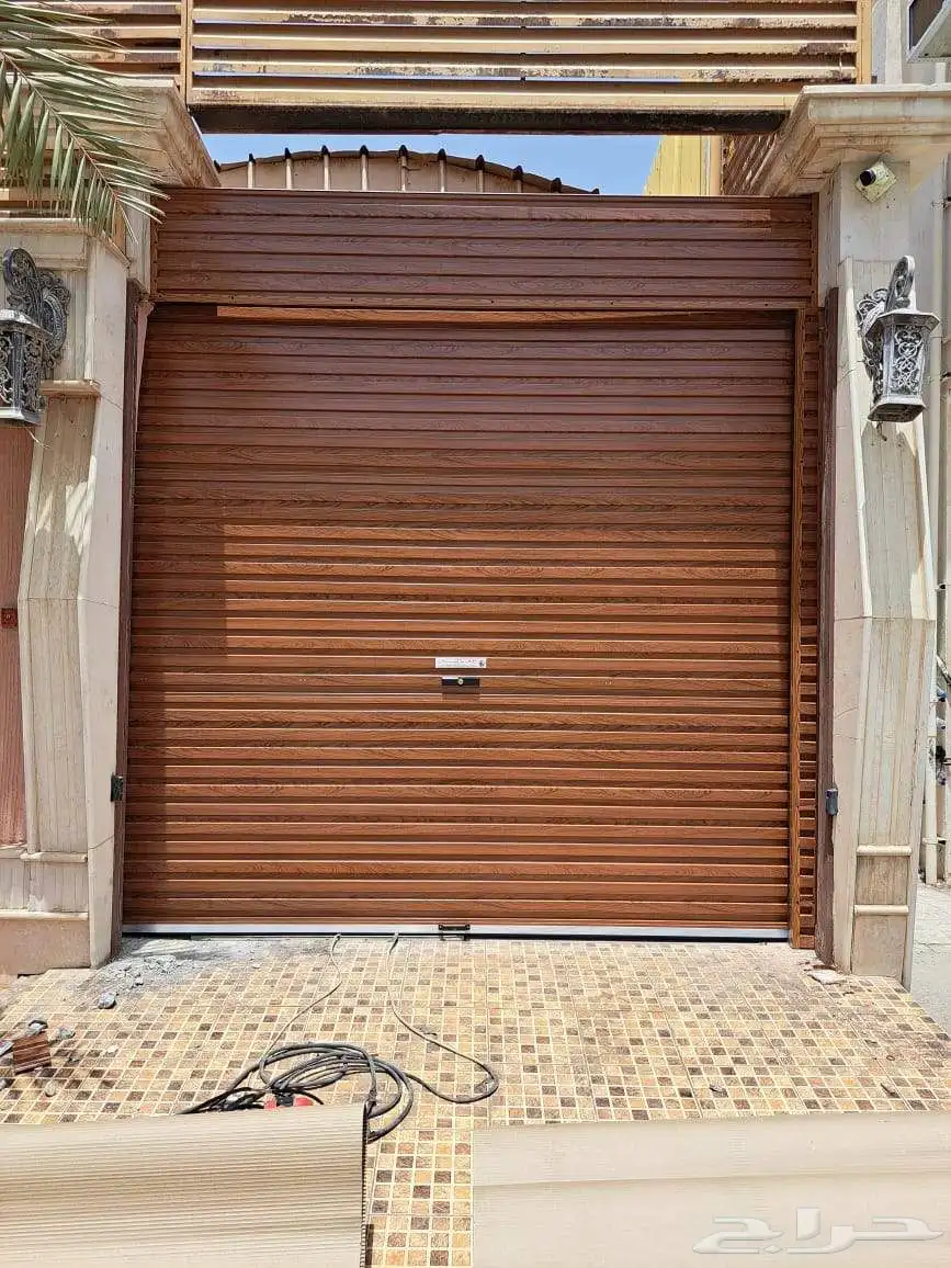 تركيب وصيانة جميع انواع أبواب الكرجات الأوتوماتيكية والنوافذ 4