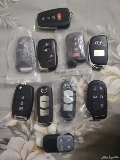 محل مفاتيح فتح سيارات وبرمجه ريموتات بصمه 0