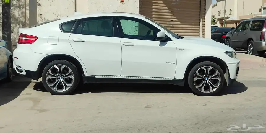 BMW X6 xDrive35i موديل 2014 - أبيض - فل كامل 9