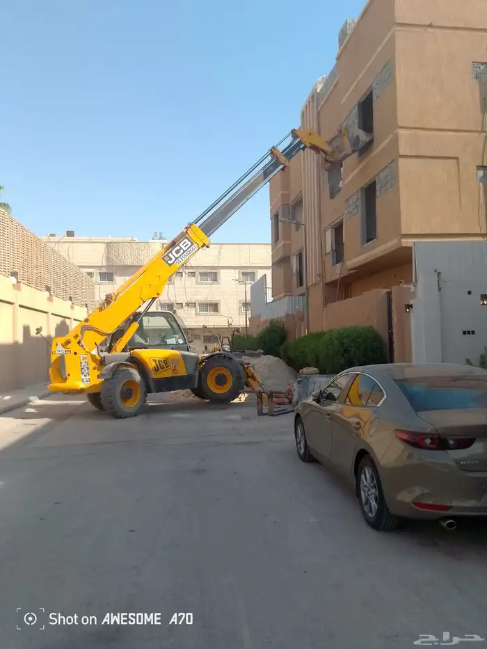 رفعه جي سي بي بوم لرفع جميع مواد البناء 3