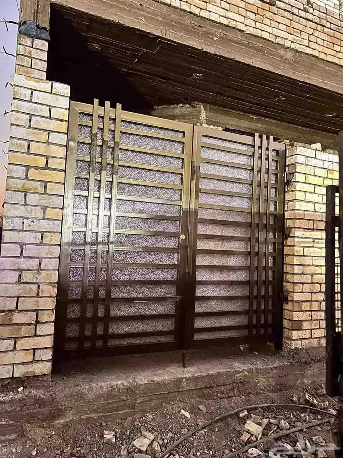 أبواب حديد وأبواب خشب وأبواب المنيوم وأبواب سحاب جلدو هناجر 5
