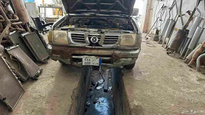 سيارة ددسن 2002 مع اللوحة مميزه نقل 4