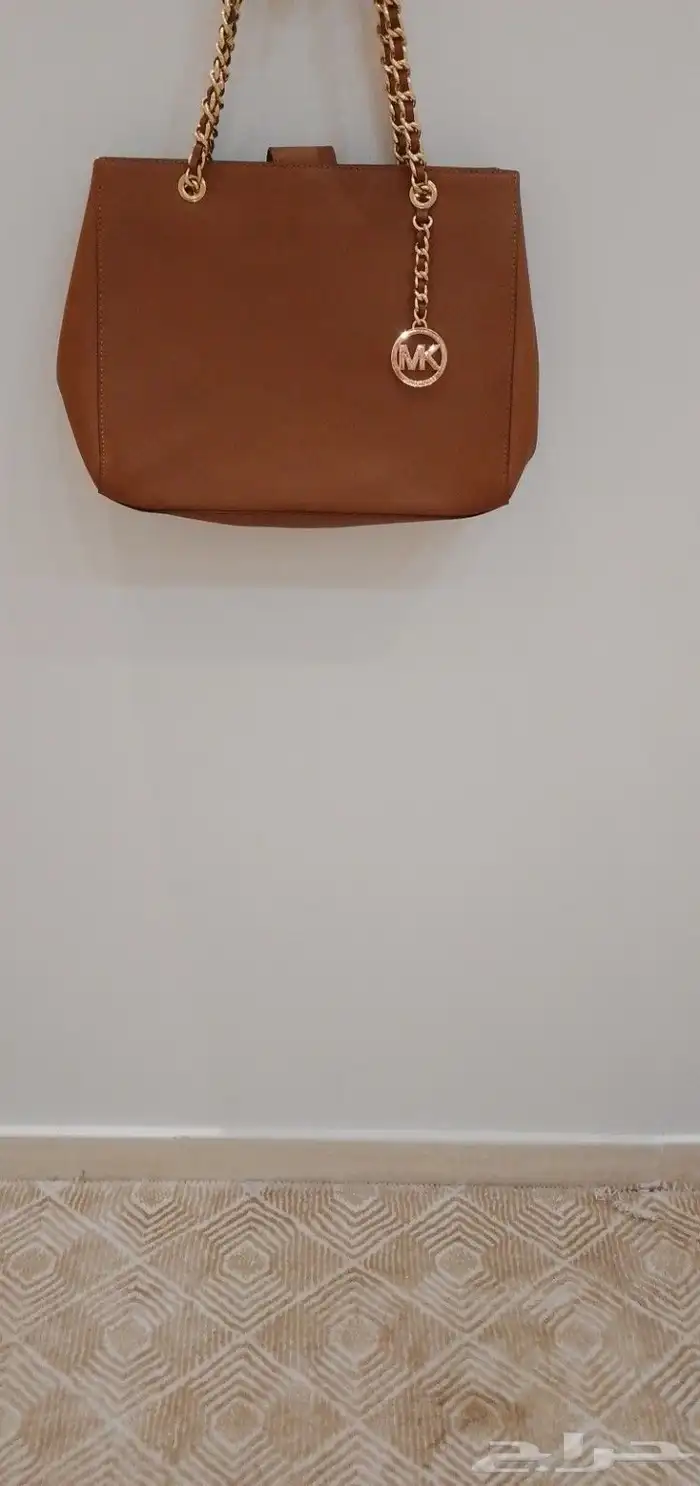 شنط نسائيه اسود ماركة دكني وبني ماركة ماريكل كورس 1