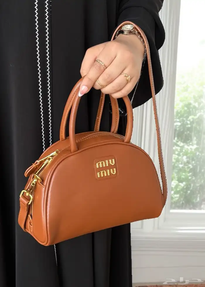 متجر_كاتشي شنطة جلد ميوميو اركادي لون بني داكن بمقابض علوية 0