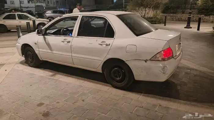 متسوبيشي لانسر 2006 للبيع قير عادي ممشي1000مغيير مكينه 12