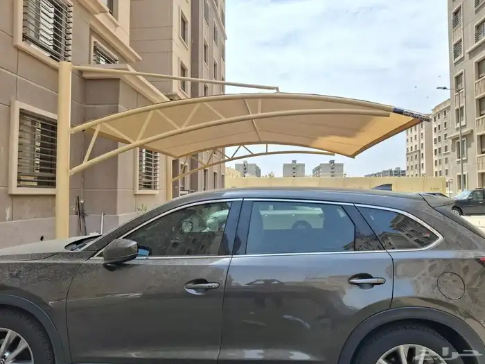 Car canopies in Jeddah changing fabric installing screens an 8
