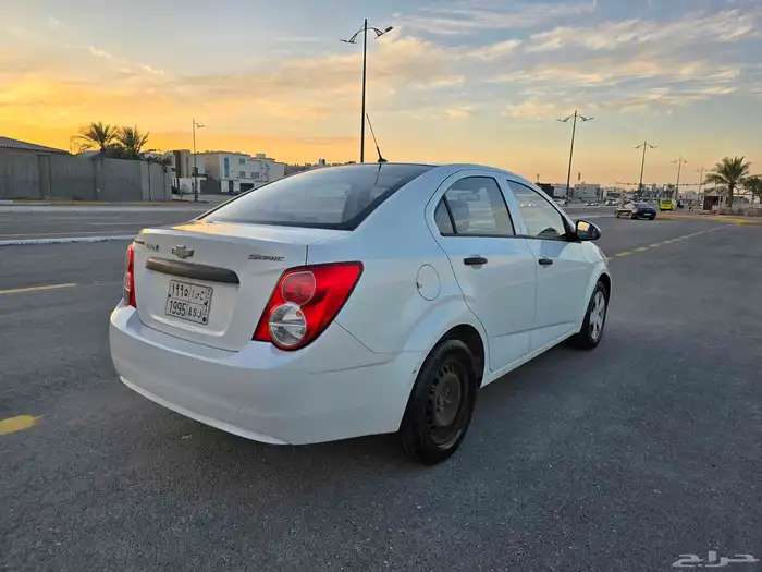Chevrolet Sonic 2013 white first owner driven 69000 only rea 3